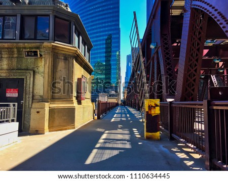 Shadows from el tracks splay across Lake Street drawbridge in Chicago Loop.