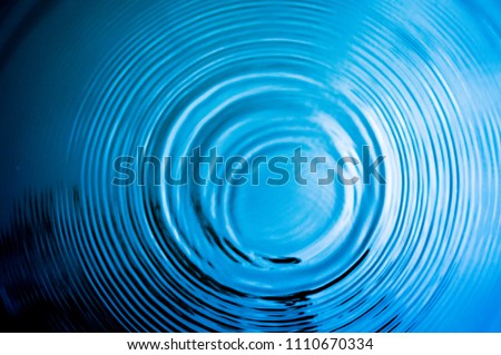 Top view Closeup blue water rings, Circle reflections in pool. Royalty-Free Stock Photo #1110670334
