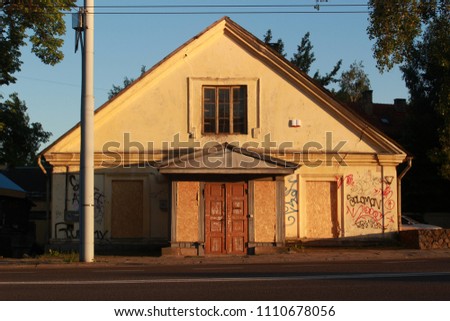 An abandoned or foreclosed house at sunset in the old town of Vilnius, Lithuania.