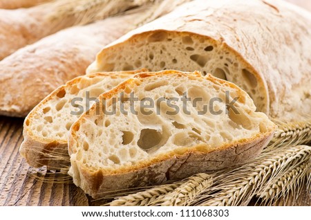 ciabatta with ears on the wooed table Royalty-Free Stock Photo #111068303