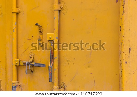 Yellow shipping container background texture,security door of a container