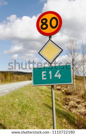 Primary road number E14 with speed limit 80 kmh in the Swedish province of Jamtland. Royalty-Free Stock Photo #1110722180