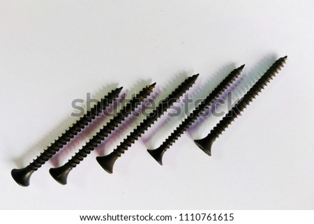Black screws isolated on white 