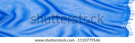 fabric silk texture. background. blue color. a fine, strong, soft, lustrous fiber produced by silkworms in making cocoons and collected to make thread and fabric.