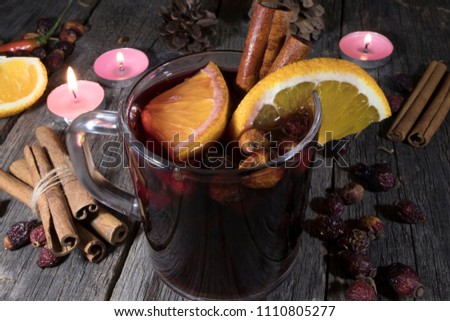 glass of mulled wine on a wooden background