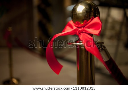 red bow at the store opening. solemn cutting of a red ribbon. Solemn opening ceremony of a new shopping center