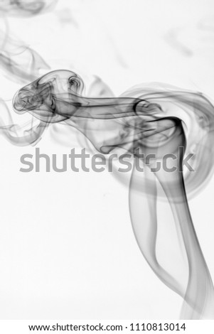 black and white smoke on dark background
