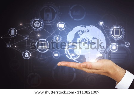 Hand holding digital business interface on blurry background. Technology, communication and global concept