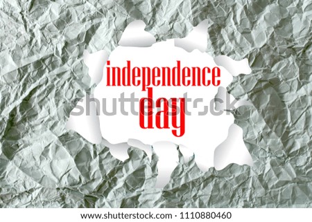 independence day word written on a crumpled paper