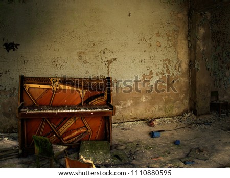 The old piano in a ruined house. Abandoned city. Chernobyl, Ukraine, nuclear accident. Old building. Royalty-Free Stock Photo #1110880595