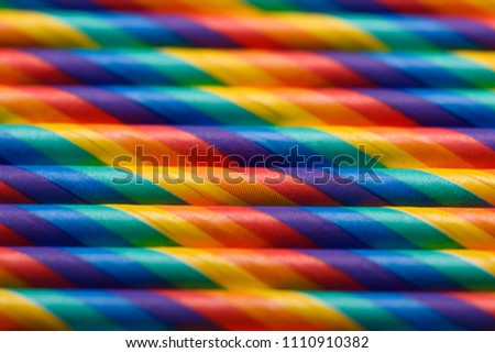Colorful paper straws in row abstract background