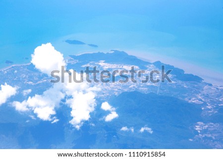 Aerial view from airplane window with sky clouds