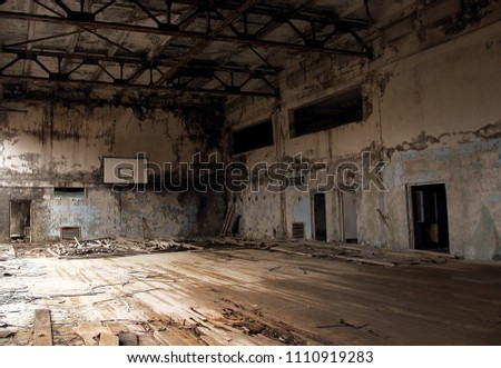 abandoned gym in Pripyat. an old building, a basketball hall, a playground for sports Royalty-Free Stock Photo #1110919283