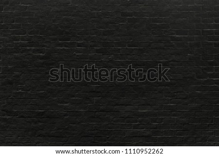 Black brick wall texture background for pattern design.