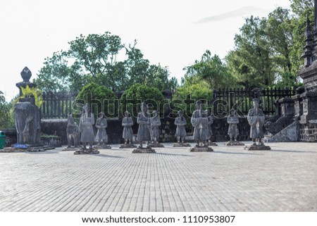 Tomb of Khai Dinh with Mandarin Honour Guard in the Honour Courtyard. Statues in line at the Khai Dinh tomb in Hue, Vietnam Royalty-Free Stock Photo #1110953807