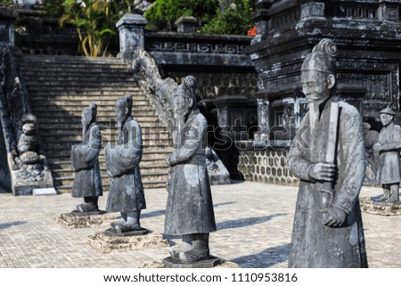 Tomb of Khai Dinh with Mandarin Honour Guard in the Honour Courtyard. Statues in line at the Khai Dinh tomb in Hue, Vietnam Royalty-Free Stock Photo #1110953816
