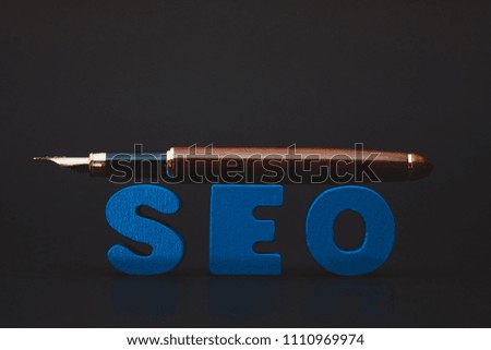 SEO text alphabet for Search Engine Optimization concept and pen, business SEO.