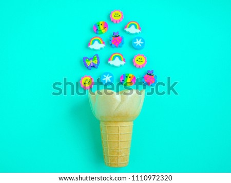 Ice Cream Cone with Cute Colorful Eraser Rubber on Aqua Blue Background, Minimal Summer Concept.