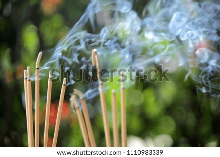 Incense burning Embossed in an incense pot. There is a lot of smoke.