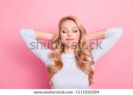 Portrait of cute attractive good girl with modern hairdo natural makeup holding hands behind the head keeping eyes closed dreaming about journey, trip, traveling