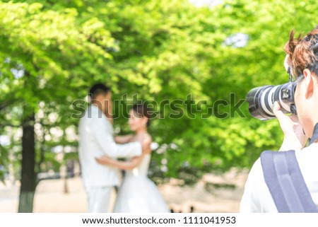 wedding photographer working on wedding