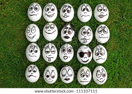 Many white eggs with funny faces