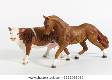 luxury baby rubber horse and cow toys for animal collection on white background.
