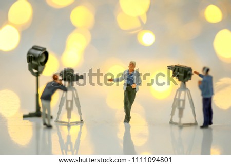 Miniature people : Actress in front of the camera on the film set blur bokeh, Group movie scene