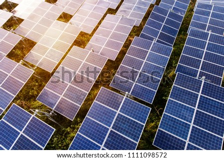 Beautiful sunset over Solar Farm with sunset on the background