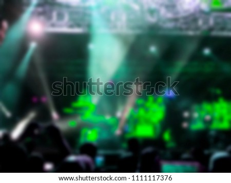 Blurred abstract background. Bokeh lighting in concert with audience