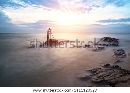 Nature photographer,Beautiful stone background on the beach at sunset in Pattaya, Thailand.