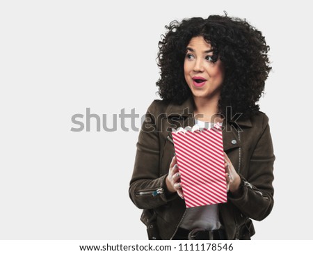 young woman holding popcorn
