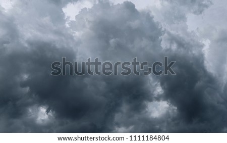 Dark storm clouds before rain used for climate background. Clouds become dark gray before raining. Abstract dramatic background.