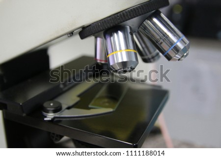 A close-up of a microscope