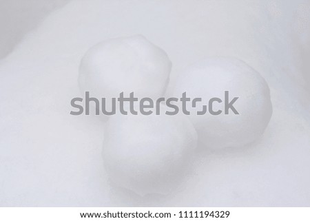 Snowballs in snow.