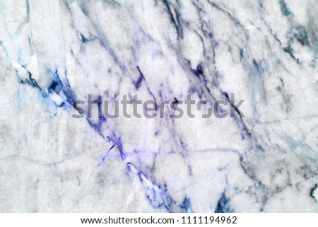 Closeup beautiful blue stained line marble that happening sedimentary rock and metal organic environment on fading white natural stone for background