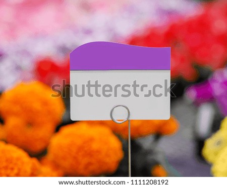 Piece of paper, tag or label with colorful flowers background