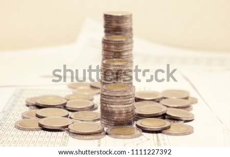 A pile of coins,Graph from coins,Business growth
