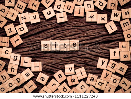 Site word written cube on wooden background. Vintage concept.
