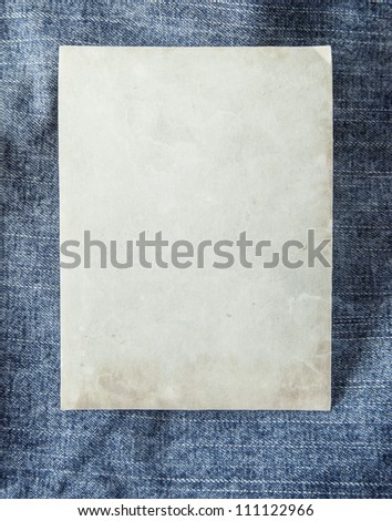 Paper card on blue jeans fabric