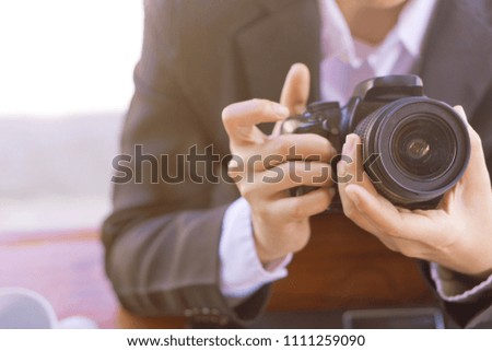 The photographer is setting up the camera.