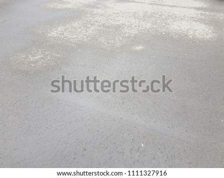 Wet asphalt, puddles