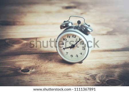 vintage watch on wooden table background