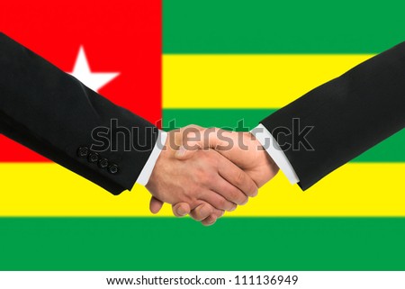 The Togo flag and business handshake