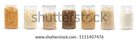 Set of Plastic transparent bags with full of groats isolated on white background. Packages with peas, semolina, rice, seeds, buckwheat grain, oat flakes, sugar. Mockup. Royalty-Free Stock Photo #1111407476