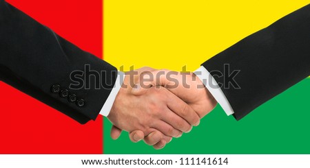 The Guinea-Bissau Flag and business handshake