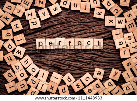 Perfect word written cube on wooden background. Vintage concept.