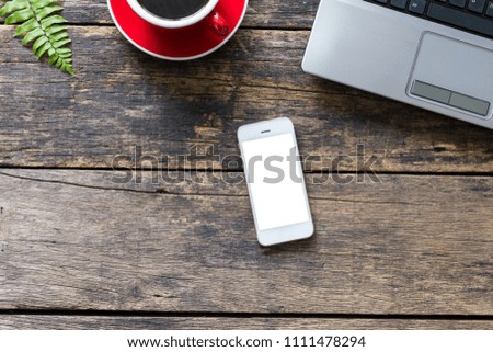 empty screen smart phone and computer on wooden table top view. with clipping path