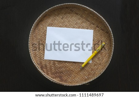 Blank notebook with yellow pen on threshing basket . writing concept / love / valentine / happy birthday