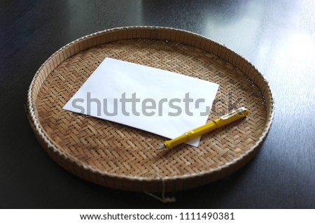 Blank paper with yellow pen on threshing basket . writing concept / love / valentine / happy birthday